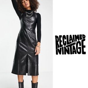 Reclaimed Vintage Faux Leather Dress midi pinny dress with pockets in black